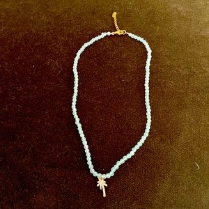 Beautiful crystal necklace with palm at center